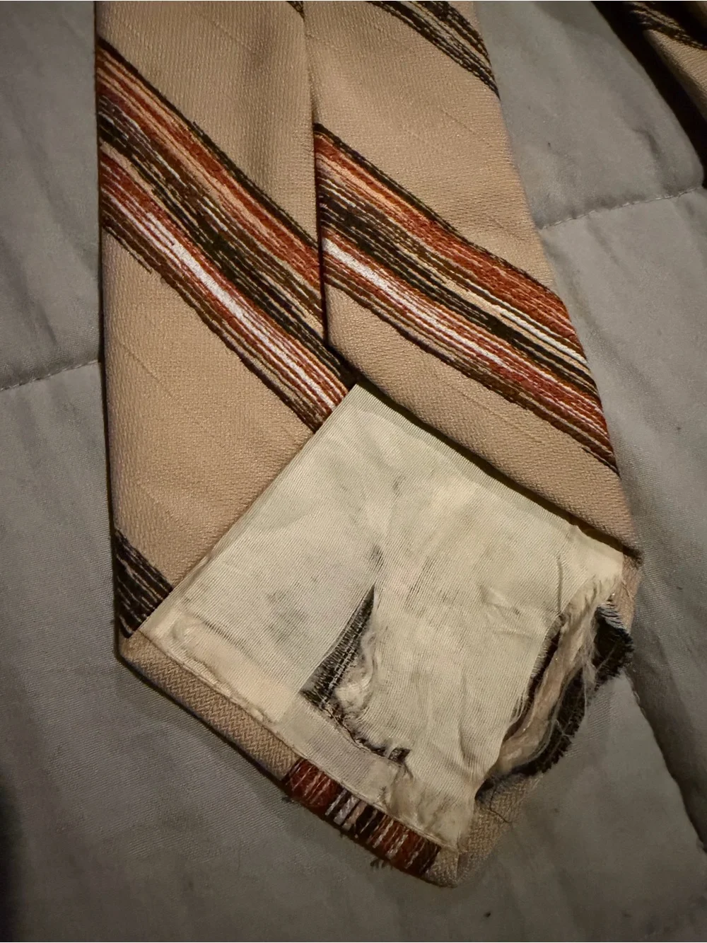 Beige Men's Striped Necktie with Orange and Brown Accents